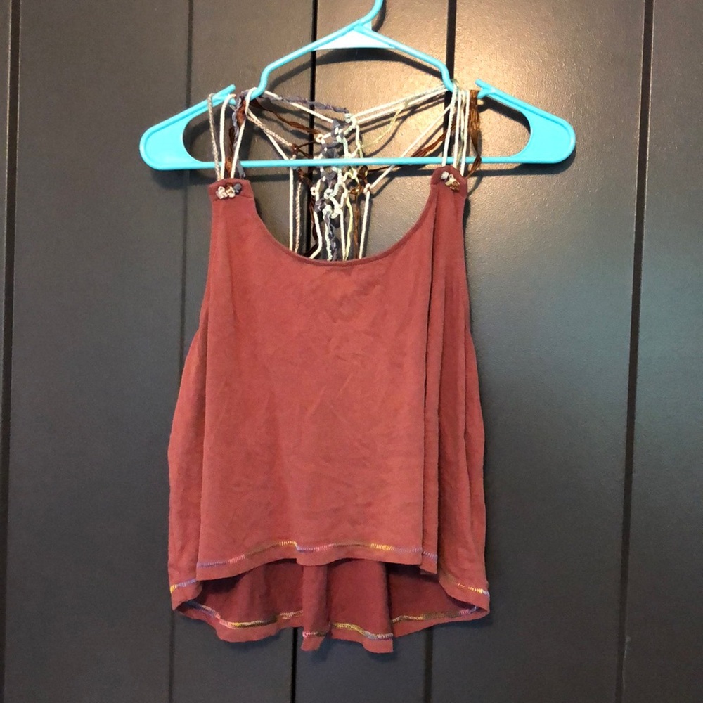 Red tank with intricate straps